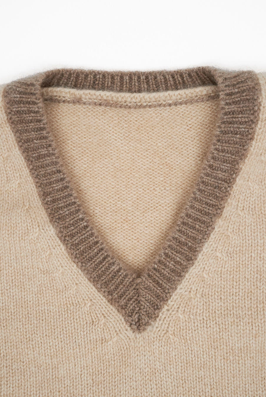 Cashmere sweater for children in natural sand with natural taupe trim.