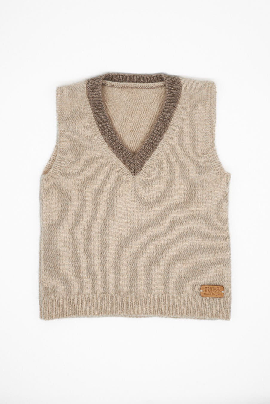 Classic V-neck cashmere blouse for children with contrasting trim in natural colors.