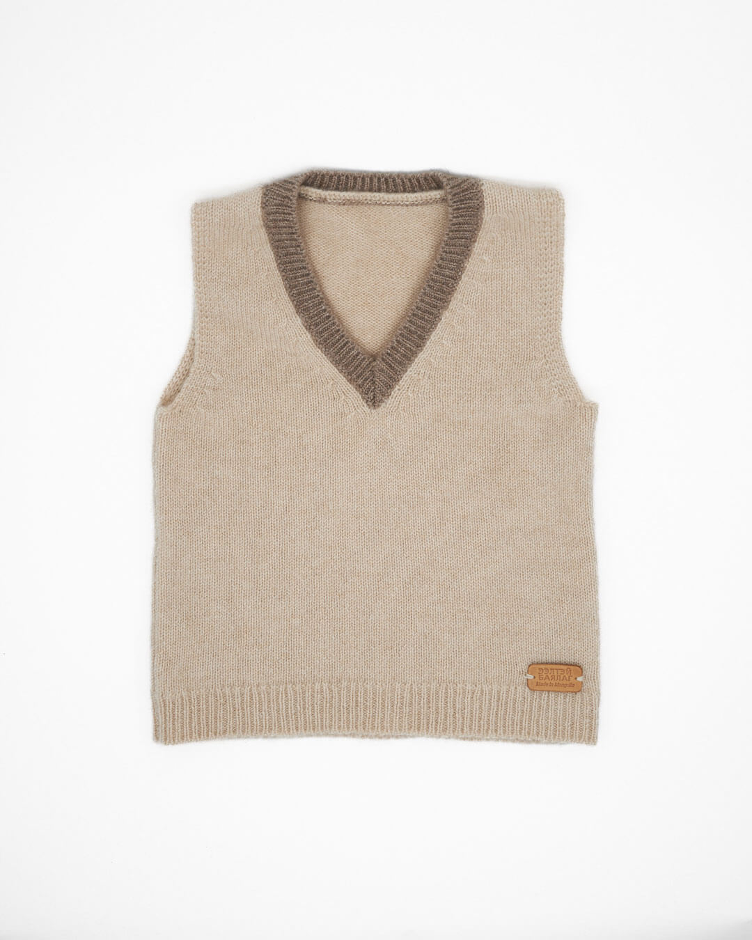 Classic V-neck cashmere blouse for children with contrasting trim in natural colors.