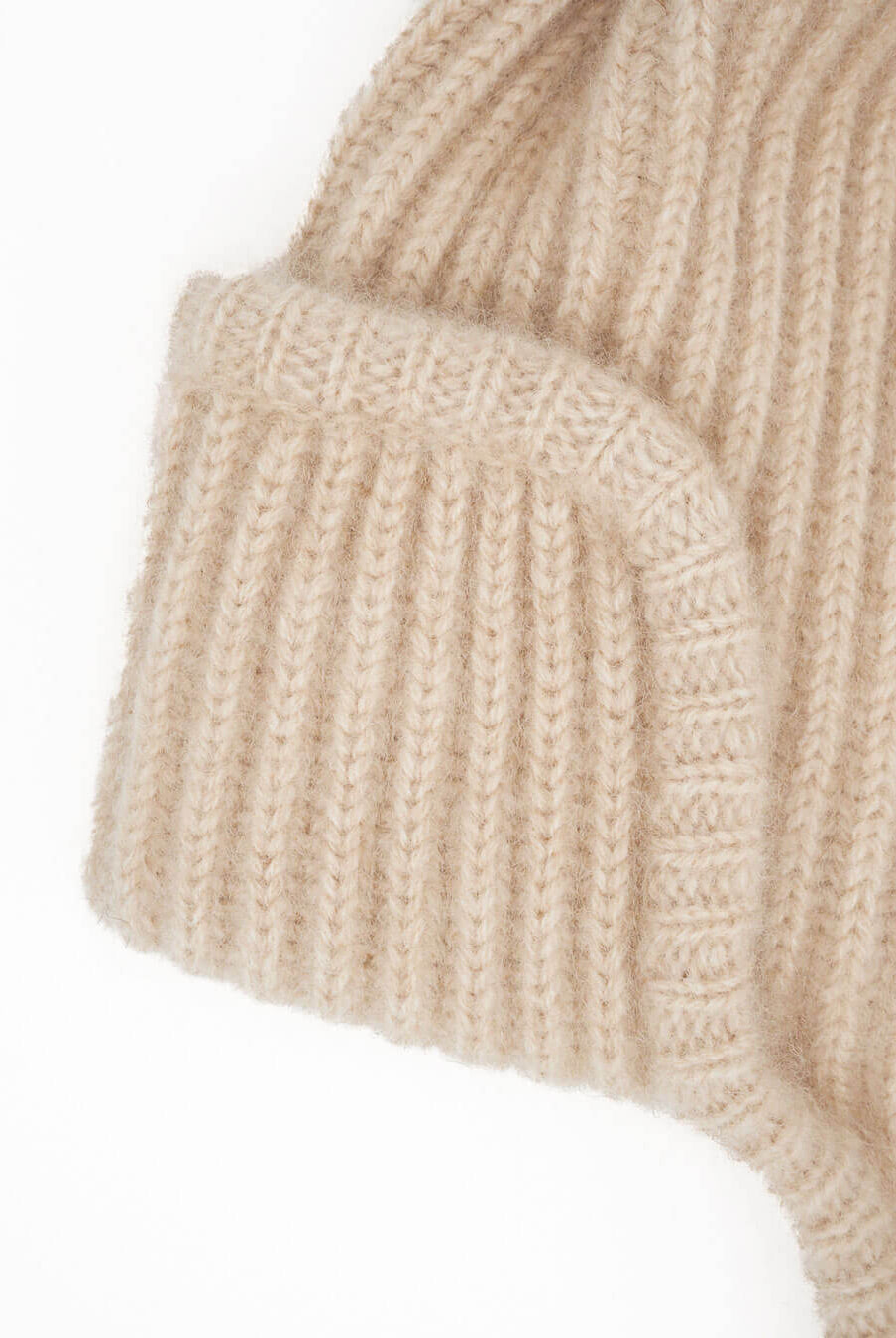 Classic rib knit with ear flaps and ties seen from the side.