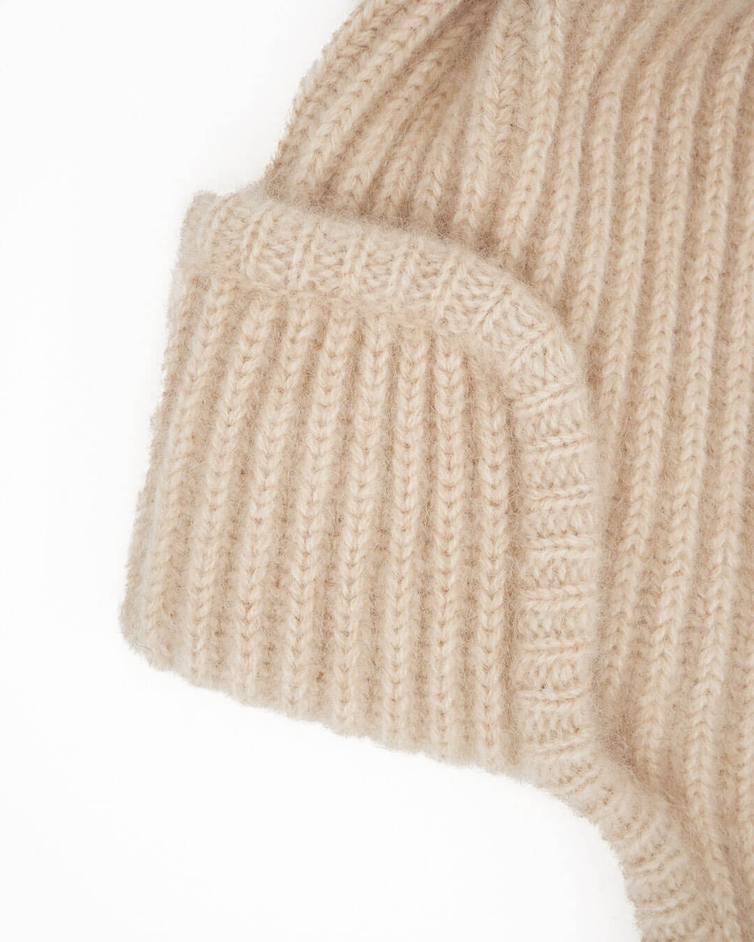Classic rib knit with ear flaps and ties seen from the side.