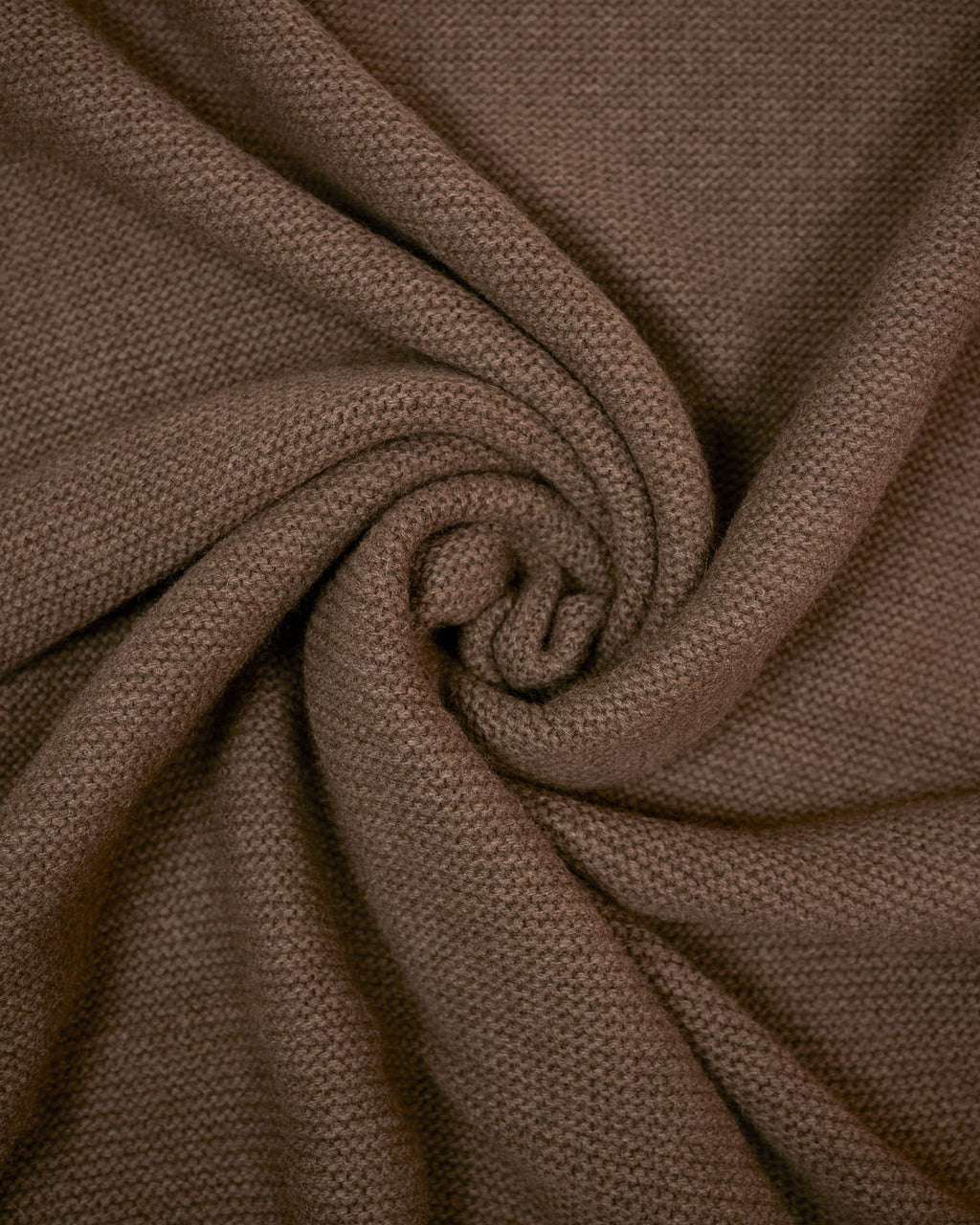 Detalje af chunky strik i Barkhan yakuld plaid, rullet for teksturvisning.