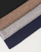 Undarmaa's lightweight cashmere scarves in dark gray-beige, light gray, black, and navy blue